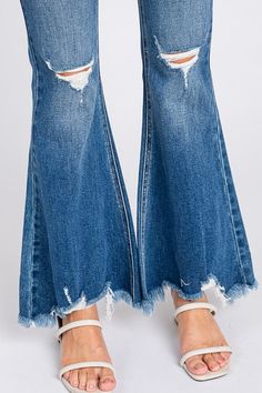 10" Rise, 34" Inseam, Modeled in size 3/25- Leg opening : 26"- High waisted Super Flare jeans- Distressed with Frayed hem- Button closure and zip fly- 5-pocket styling 88% COTTON,10% RAYON,2% SPAN Medium Wash Flare Bottoms With Frayed Hem, Fall Jeans With Frayed Hem And Standard Cut Leg, Dark Wash Flare Jeans With Frayed Hem For Spring, Distressed Flare Bottoms For Fall, Spring Flare Jeans Dark Wash With Frayed Hem, Spring Flare Jeans In Dark Wash With Frayed Hem, Flare Distressed Bottoms For Fall, Spring Dark Wash Flare Jeans With Frayed Hem, Flare Jeans With Frayed Hem