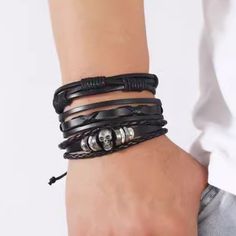 Transform your outfit with our Three Piece Star Braided Leather Bracelet - a stylish and versatile accessory that adds a touch of edginess to any look. This bracelet features a unique braided leather design and three star charms, making it the perfect statement piece for any occasion. Elevate your style and stand out from the crowd with this must-have accessory! -Hide -Star Graphic -Punk Style Black Bohemian Leather Bracelet, Casual Black Braided Bracelets, Trendy Black Leather Bracelet, Casual Black Braided Jewelry, Trendy Black Band Leather Bracelet, Bohemian Black Leather Braided Bracelets, Black Leather Bohemian Braided Bracelets, Bohemian Black Leather Braided Bracelet, Star Graphic