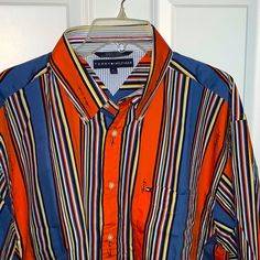 Nwot! Men’s Tommy Hilfiger Button Down Shirt. Size Xl. Blue And Orange Stripes. Signature Collection! See Pictures For Details Before Purchasing Tommy Hilfiger Casual Shirt With Buttons, Orange Long Sleeve Shirt With Pockets, Tommy Hilfiger Cotton Graphic Print Shirt, Tommy Hilfiger Button-up Tops, Tommy Hilfiger Blue T-shirt With Letter Print, Orange Button-up Shirt With Pockets, Orange Button-up Shirt With Button Closure, Tommy Hilfiger Cotton Button-up Shirt, Tommy Hilfiger Cotton T-shirt With Text Print