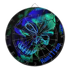 a dart board with an image of a human skull on the front and blue light behind it