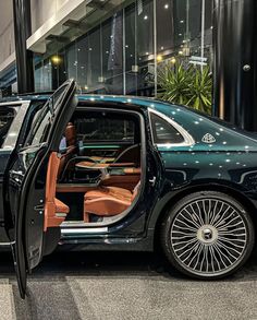 a black car with its door open on display