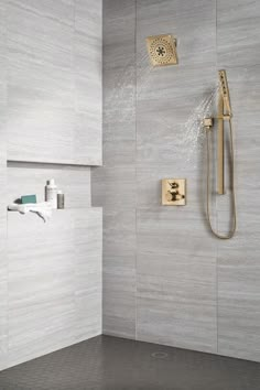 the shower head and hand shower are connected to the faucet in this modern bathroom