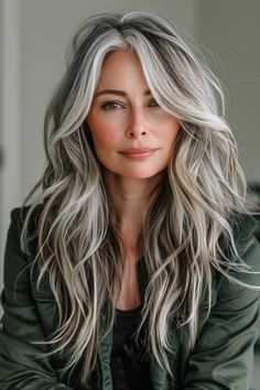 Combine long layers with balayage for a dynamic and stylish look. These hair styles for women over 50 offer versatility and an elegant flair that complements your natural beauty. Gray To Blonde Hair Balayage, Long Grey Hair With Layers, Grey Hair Blending Blonde, White Hair With Dark Highlights, Long Layered Salt And Pepper Hair, Grey To Blonde Balayage, Grey Colored Hair For Women, Grey Hair With Dark Underneath