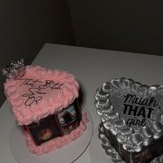 two heart shaped cakes sitting on top of a white table next to eachother