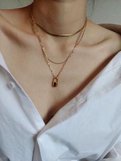 Lock necklaces have probably been popular for decades. And I remember more than 10 years ago when I was a child, my good friends and I would buy a lock necklace and a key necklace. A very classic necklace. ♥ SIGN UP for 10% OFF your first order: https://bit.ly/3olIlWf ♥ DETAILS - Length: adjustable from 40cm to 45cm - Materials: Stainless steel, 18k gold plating. - Nickel-free, anti-corrosion, tarnish-resistant, and hypoallergenic. - Safe for sensitive skin. - Waterproof Necklace: you can wear i Gold Locket Necklace For Birthday, Lock Necklaces, Waterproof Necklace, Necklace Lock, Boho Choker Necklace, Silhouette Necklace, Necklace Friendship, Chunky Choker, Padlock Necklace