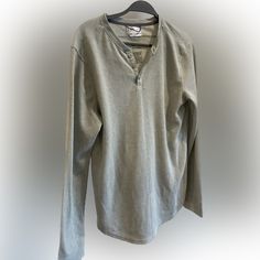 Stay Cozy And Stylish With This Heather Gray Waffle-Knit Henley From All In Motion. The Shirt’s Textured Fabric And Classic Three-Button Placket Make It A Versatile Piece For Any Casual Look. Designed For Comfort, Its Waffle-Knit Pattern Provides A Breathable Fit That’s Ideal For Layering Or Wearing On Its Own. Size: S Condition: Gently Used A Great Addition To Your Activewear Or Weekend Wardrobe, This Henley Is Perfect For A Jog In The Park Or A Relaxing Day At Home. Casual Waffle Knit Henley For Fall, Casual Winter Tops With Henley Neckline, Casual Henley Neckline Winter Top, Casual Winter Waffle Knit Henley, Casual Gray Knitted Top, Casual Winter Waffle-knit Henley, Casual Waffle Knit Sweater For Layering, Casual Cotton Knitted Tops, Casual Gray Knit Tops