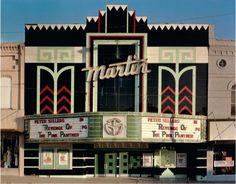 the marquee for the theatre mattit is painted black and white with red accents