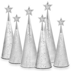 five silver christmas trees with stars on top