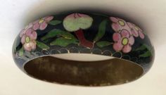 "This is a beautiful early Chinese export very wide cloisonne enamel bangle bracelet. handpainted Cobalt black Peonies and peach. hollow with a brass interior. black background with multi colored flowers. Brass. Art Deco Jewelry c1900 6/8\" Wide x 2 5/8 \" Internal Circumference. Weight 1.97 oz. Please examine the photos carefully, I take great effort to take quality photos of all angles and a picture is worth a thousand words. I guarantee the item to be as described. If you have any questions f Black Enamel Bangle Bracelet, Black Enamel Bracelet Jewelry, Artistic Black Enamel Jewelry, Handmade Enamel Bangle, Black Enamel Bracelet Gift, Black Enamel Bracelets Gift, Black Enamel Bracelets For Gifts, Vintage Handmade Enamel Bangle, Handmade Vintage Enamel Bangle