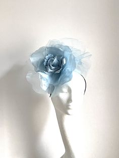 Large pale blue flower hat This amazing large blue flower hat is made from organza and velvet fabric. The hat sits on the black fabric-covered headband to which I attached a comb so it will sit steadily on your hair. A large blue flower hat will be an amazing accessory to compliment your outfit. It will fit the average head size. You can wear this amazing hat at the wedding, Christening, Horse races, and any other special occasion. Enjoy and please have a look in my shop for more hats and fascin Blue Flower Wedding, Horse Races, Royal Ascot Hats, Bride Hat, Flower Hat, Wedding Hat, Kentucky Derby Hat, Giant Flowers, Derby Hat