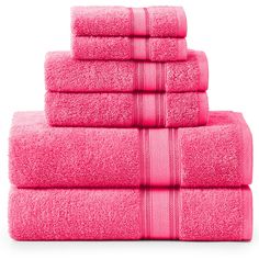 six pink towels stacked on top of each other in front of a white background,