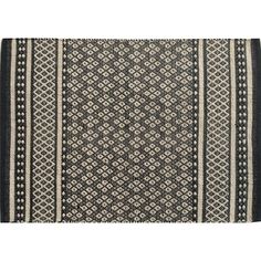 a black and white rug on a white background