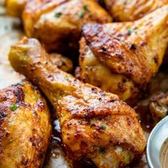 grilled chicken wings with dipping sauce on the side