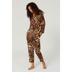 Brown animal printed charmeuse (100% Polyester). Top. Long sleeves. Shirt collar neckline. Front button closure. Pockets. 25" from shoulder to hemline. Imported. Leopard Pajamas, Rent The Runway, Closet Designs, Polyester Top, Pajama Top, Shirt Collar, Black Print, Pajamas, Long Sleeves