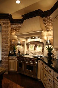 a kitchen with an oven, stove and sink in it's center island area