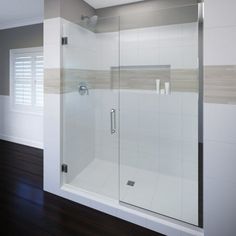 an empty bathroom with a glass shower door