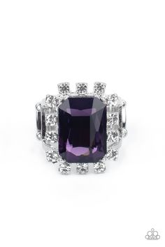 Featuring dainty silver square fittings, an explosion of glassy white rhinestones fans out from a dramatically oversized emerald cut purple rhinestone center, creating a stellar centerpiece atop the finger. Features a stretchy band for a flexible fit.

 Sold as one individual ring. Purple Ring, Purple Rings, Purple Gems, Purple Rhinestone, Rhinestone Ring, Paparazzi Accessories, White Rhinestone, Bling Rings, Paparazzi Jewelry