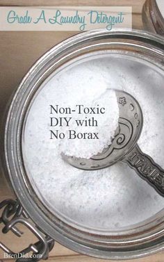 there is a spoon in a bowl with white powder on it and the words non - tonic diy with no borax