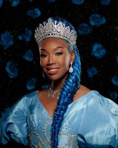 a woman with long blue hair wearing a tiara