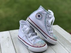 White Converse Touch of Bling Sneakers Little Kids Shoe Size 10-2 These authentic white Converse have a touch of bling on the toe, Converse emblem and back of the shoe. Information about the shoes All sneakers are Converse brand and have a mix of hand applied high quality glass crystals and resin flat-backs. Please select your color choice by the available drop down options, an option of all glass crystals no color is also available. Converse sizing is unique and sneaker specific. Converse Kids White Rhinestone Round Toe Sneakers, White Bling Lace-up Sneakers, Low-top White Sneakers With Bling, White Low-top Sneakers With Bling, White High-top Sneakers With Rhinestones, Ladybug Tutu, Bling Sneakers, Converse Collection, Purple Converse