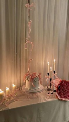 a table topped with a cake and candles