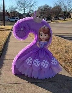 a purple princess costume on the sidewalk