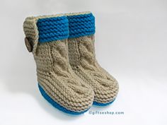 a pair of knitted boots with buttons on them