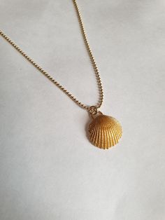 A sea shell necklace made of natural shells casted in brass and plated with quality, nickel free 14k gold plating. The necklace is made of 14k gold filled. Gold Minimalist Necklace For Beach, Minimalist Gold Necklaces For The Beach, Minimalist Gold Necklace For Beach, Gold Shell-shaped Necklace, Gold Shell Necklace With Clavicle Chain, Gold Shell-shaped Necklace With Clavicle Chain, Ocean-inspired Gold Shell Charm Necklace, Dainty Gold Shell Charm Necklace, Dainty Gold Shell-shaped Necklace