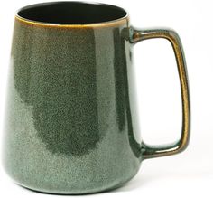 a green and black coffee mug on a white background