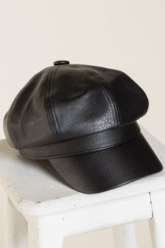 Top off your look with this so cool slouchy newsboy cap featured in an edgy leather design. -Color: Black -Faux leather -Adjustable -Content: 45% PU 55% Polyester -Imported Newsboy Cap, So Cool, Leather Design, Design Color, Black Faux Leather, The Label, Black Leather, Faux Leather, Leather