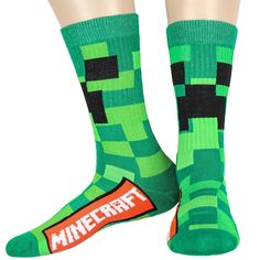 Minecraft merchandise. Do you love to play Minecraft? If you do, you need to get these socks to add to your collection. These green great thick socks feature an all-over cubed Creeper design. Made of 98% Polyester, 2% Spandex. These are awesome socks that will keep your feet warm and comfy all day long. Green Novelty Socks For Winter, Playful Green Socks For Stocking Stuffers, Playful Green Socks For Gifts, Minecraft Merchandise, Awesome Socks, Play Minecraft, How To Play Minecraft, Thick Socks, Cool Socks