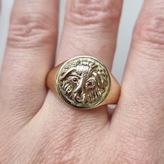 "A fantastic unisex ring featuring the head of a bull with ruby eyes, flashed in rose gold, with a white gold nose ring, mounted in 9ct yellow gold and fully hallmarked. Hallmarked as 9ct gold, dated Birmingham 1983. Maker's mark \"KBSP\". The diameter of the face measures approximately 14mm. The approximate weight is 6.2 grams. Please note that the antique ring box shown is for display purposes only. Thank you. Ring size S ½ (UK) or 9 3/8 (US) - this ring can be adjusted in size in our workshop. Please get in touch to discuss sizing options and lead time. For UK to US ring size conversions we use www.ringsizes.co as our reference chart. CONDITION: In very good vintage condition, with some light surface wear commensurate with age. LAYAWAY: We happily offer layaway/deposits on the majority Bull Ring, Antique Ring Box, Gold Nose Ring, Platinum Bracelet, Gold Nose Rings, Traditional Diamond, A Bull, Antique Ring, Red Band