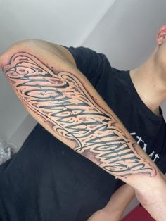 a man with a tattoo on his arm