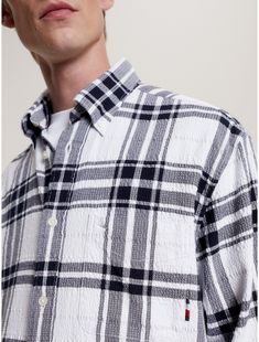 Tommy Hilfiger men's shirt. Cut from breathable, lightweight twill seersucker, our oversized tartan shirt is perfect for work and weekends.  Material: 98% Cotton, 2% Elastane. Plaid Relaxed Fit Yarn-dyed Shirt, Plaid Yarn-dyed Shirt With Relaxed Fit, Plaid Yarn-dyed Shirt Relaxed Fit, Plaid Yarn-dyed Relaxed Fit Shirt, Classic Relaxed Fit Tommy Hilfiger Shirt, Tommy Hilfiger Cotton Button-up Shirt, Tommy Hilfiger Relaxed Fit Cotton Shirt, Classic Collared Yarn-dyed Shirt, Classic Yarn-dyed Collared Shirt