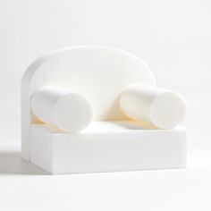 a white couch sitting on top of a table