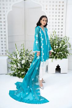 SKU: 1409 Price for Shirt, lining and Pants A classy sillhoutte with combination of white laces adorned with white pearls, and crystals and sequence to enhance this gorgeous ensemble. Hand block print dupatta can be added to give a complete look to this outfit. Shirt length 42. Model is wearing XS. Cambric Dupatta With Mirror Work For Wedding, Wedding Dupatta In Cambric With Mirror Work, White Cambric Sharara For Wedding, White Organza Sharara With Dabka, White Organza Sharara With Dabka Detailing, Summer White Unstitched Suit With Dabka Embroidery, Eid Lawn Suit With Lace Work, White Anarkali Set With Sheer Dupatta For Summer, White Dabka Organza Sets