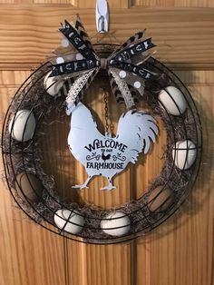 a wreath with a welcome sign hanging on it