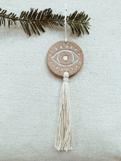 Evil Eye Tassel Ornament MuddyHeart Eye Ornament, Tassel Ornament, Bohemian Soul, Teacher Ornaments, The Evil Eye, Air Dry Clay Projects, Clay Crafts Air Dry, Clay Wall, Clay Ornaments