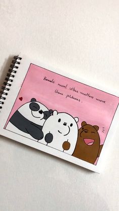 a notebook with an image of two bears and a bear hugging each other on it