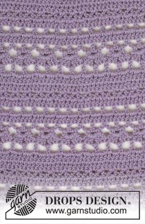 a close up of a purple crocheted blanket with white dots on it and the words ladynistro written in green