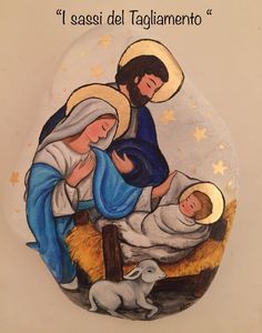 an image of the birth of jesus in a glass ornament on a wall