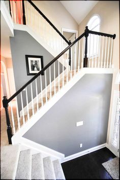 the stairs in this house are painted gray and white