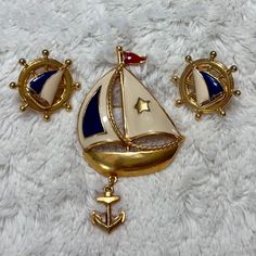 Vintage Avon jewelry set. 3" sailboat brooch 1" ship helm, clip-on earrings Both anodized, gold tone metal, with cream & blue enamel sailboat design. In good vintage condition, with light wear. Vintage Avon Jewelry, Ship Helm, Sailboat Design, Avon Jewelry, Vintage Avon, Gold Tone Metal, Jewelry Set, Clip On Earrings, Jewelry Sets