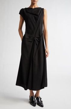 A fall '24 runway highlight, this asymmetric midi dress reimagines a signature house style with an elegant drape at the neckline and pleat detailing at the waist for effortless sophistication. 50" length (size 2) Hidden back zip; keyhole with hook-and-eye closure Asymmetric neck Single cap sleeve Unlined 100% viscose Dry clean Made in Portugal Designer Clothing Spring Pre-draped Midi Dress With Folds, Draped Midi Dress For Fall Workwear, Fall Workwear Draped Midi Dress, Elegant Asymmetrical Draped Dress For Fall, Elegant Draped Asymmetrical Fall Dress, Elegant Draped Asymmetrical Dress For Fall, Formal Pleated Midi Dress With Asymmetrical Hem, Formal Pleated Asymmetrical Midi Dress, Asymmetrical Pleated Midi Dress For Formal Occasions