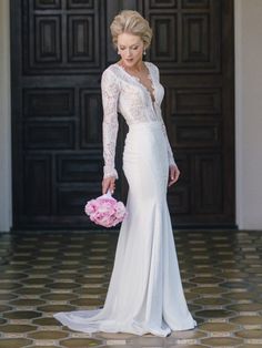 a woman in a wedding dress holding a pink bouquet and posing for a photo on her instagram page