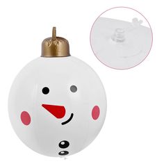 an ornament shaped like a snowman with a gold top and red nose