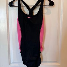 Cute Never Worn Nike Swimsuit. Pink Sleeveless Workout Bodysuit, Pink Sleeveless Bodysuit For Workout, Sleeveless Pink Workout Bodysuit, Sleeveless Pink Bodysuit For Workout, Pink Sporty Bodysuit For Sports, Sporty Pink Bodysuit For Sports, Nike Fitted Sleeveless Swimwear, Fitted Sleeveless Nike Swimwear, Sporty One-piece Pink Swimwear