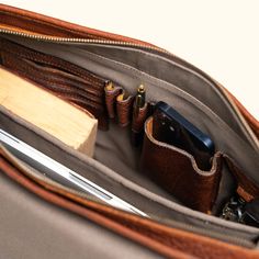 Crafted from the rich and textured full grains of buffalo hide, our limited edition Roosevelt Buffalo Leather Satchel showcases the deep and natural brown grains unique to each piece. With dimensions of 17" long and 13" high, it offers padded space for a 15" laptop screen display laptop (measured diagonally), additional storage under the flap, and an area to hold pens and accessories. Safeguard your valuables in the interior or exterior zipper pockets. The satchel's interior features our interio Luxury Rugged Rectangular Satchel, Rugged Oiled Leather Rectangular Bag, Rugged Rectangular Adventure Bags, Rectangular Rugged Bag In Waxed Canvas, Rugged Leather-lined Satchel For Business, Mens Leather Satchel, Buffalo Jackson, Iron Hardware, Leather Satchel Bag