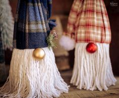 two christmas decorations made out of fringes and balls