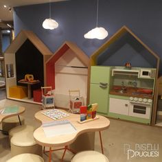 the children's playroom is equipped with wooden toys